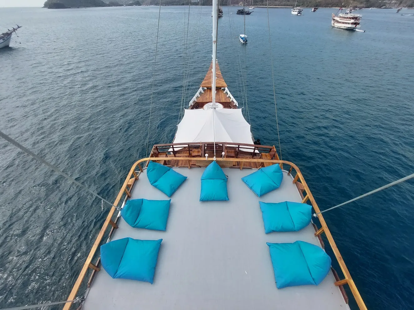 Cushioned foredeck lounging on the bow of a phinisi