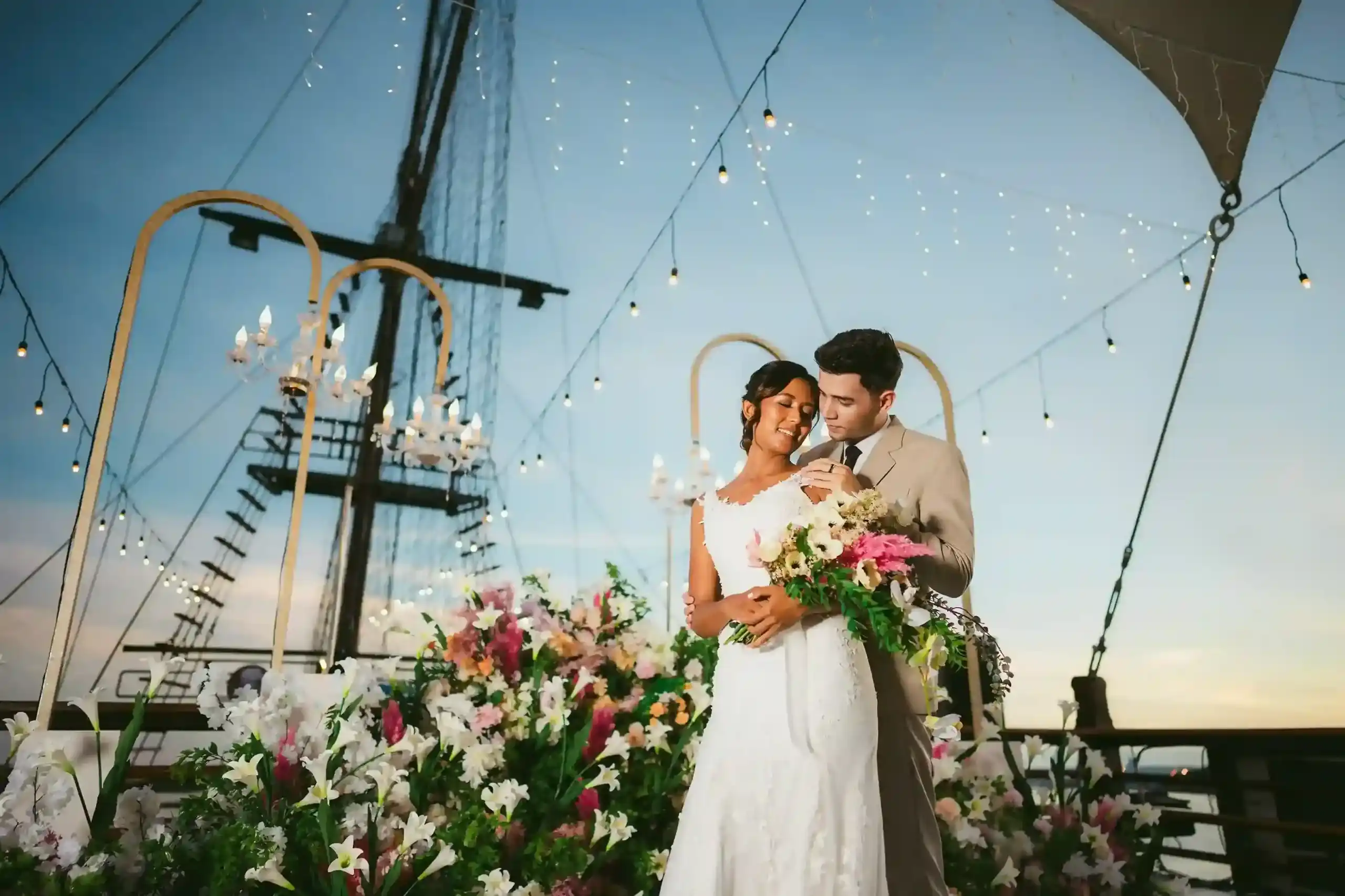 Couple under deck lights on an evening charter