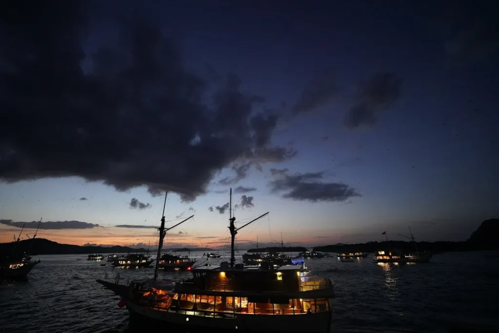 Boats moored off Kalong Island at dusk