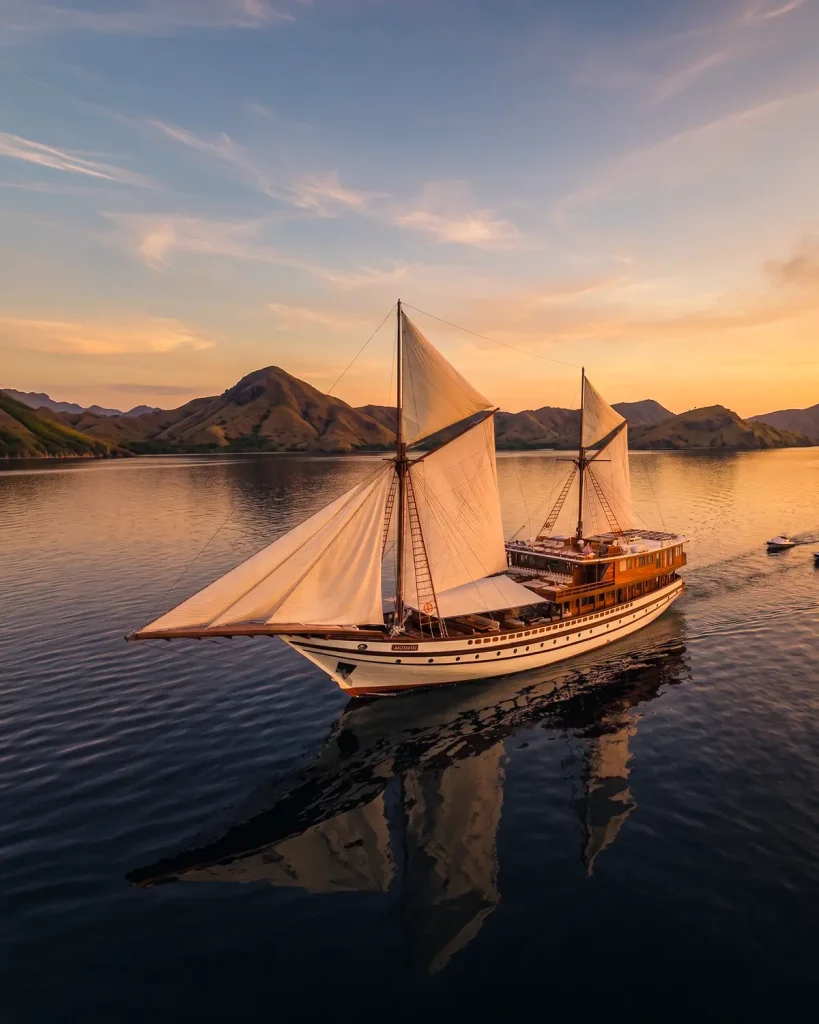 The phinisi Prana at anchor at sunset